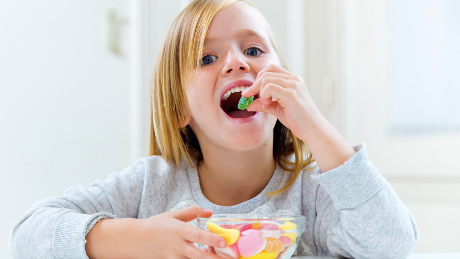 Kid eating candy