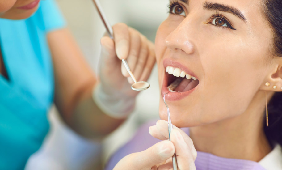 Woman Having a Dental Checkup to Avoid Tooth Loss